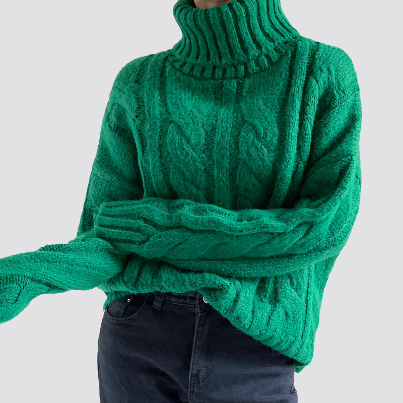 Green turtleneck cable sweater