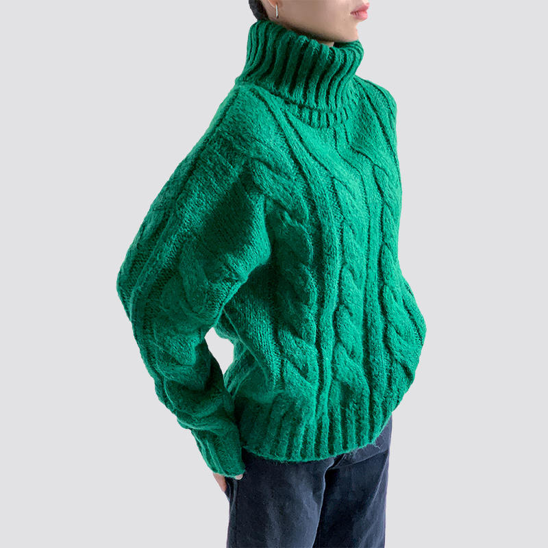 Green turtleneck cable sweater